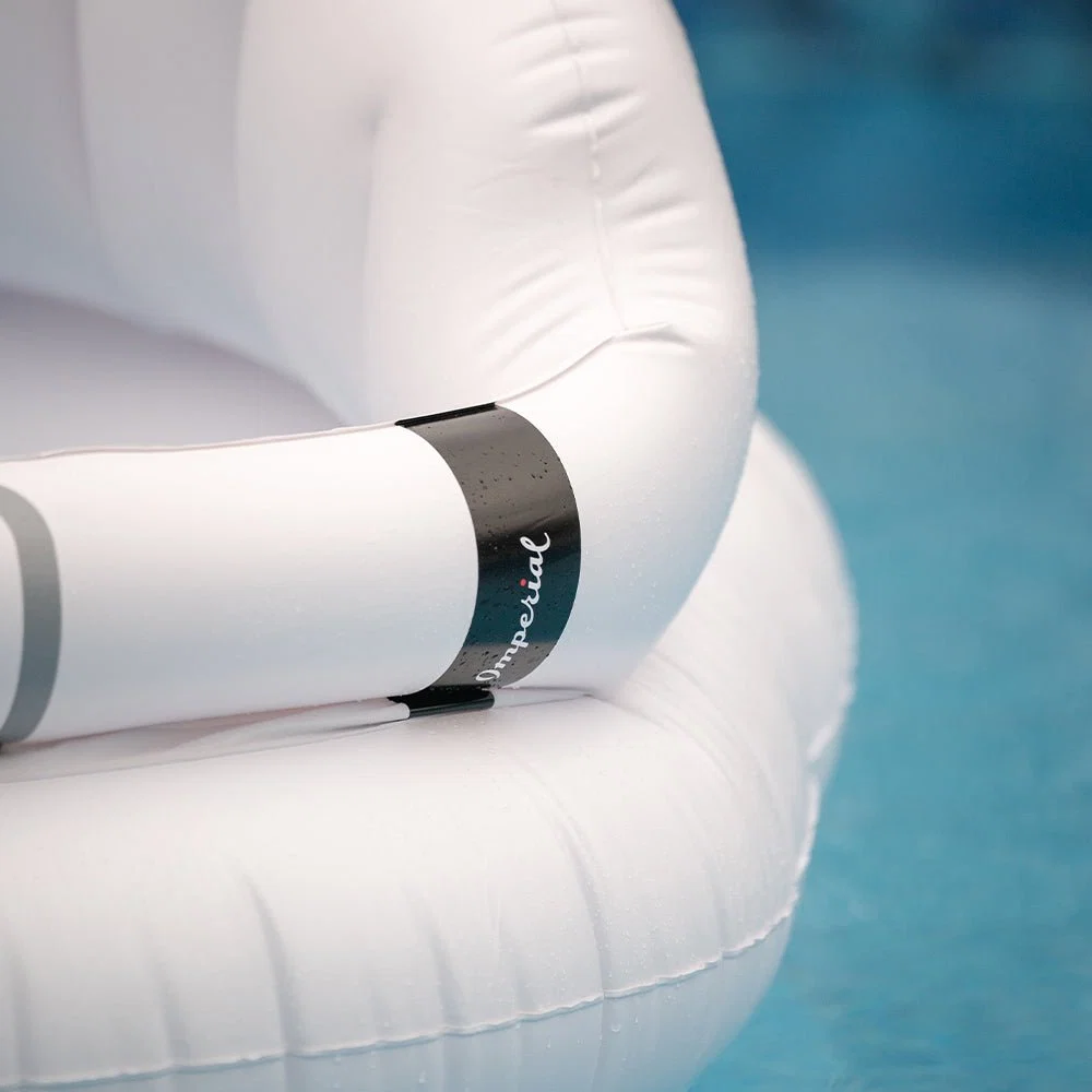 Detail of the Imperial band on the pool float's brim, echoing the woven label on the visor itself.