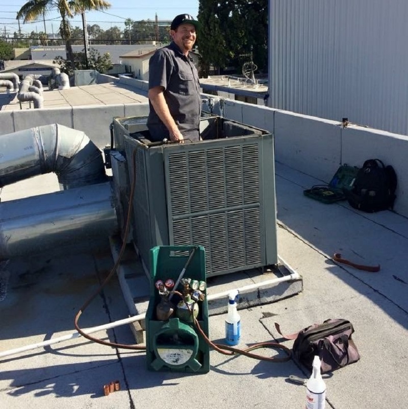 Service Manager, Glenn Skyhorse, completing a refrigerant leak check and repair