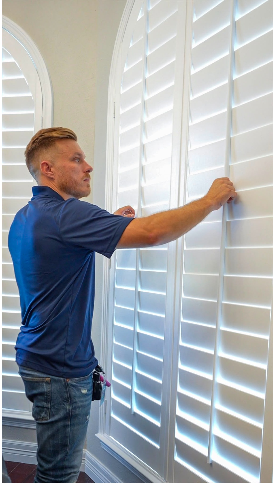 Installer measuring a window 
