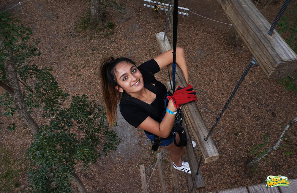Climb rope ladders at TreeHoppers TreeHoppers Aerial Adventure Park Dade City (813)381-5400