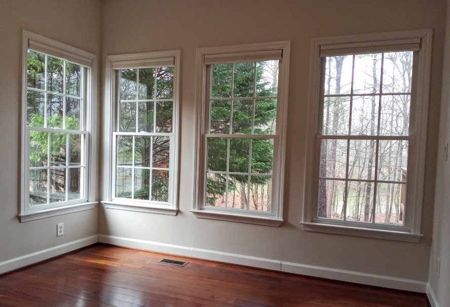 Are you concerned about maintaining a beautiful clear view out your windows? Cellular (Honeycomb) shades are a great solution as they have a very small “stack” in the top of your window, allowing for the maximum view through your window. In this case, the back of the home looks down onto a river.