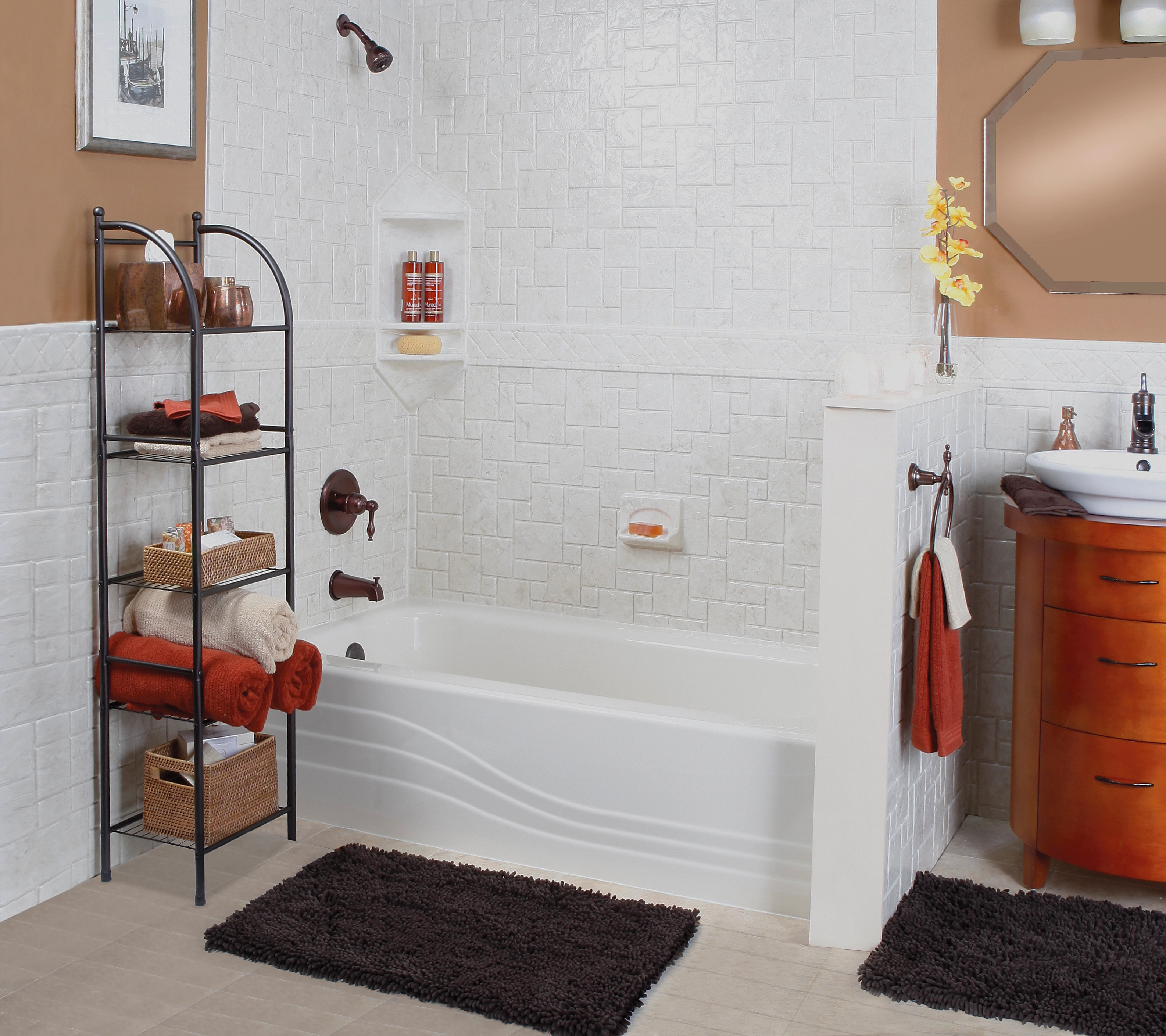 Bathtub and shower combination with textured wall surround in warm, traditional bathroom