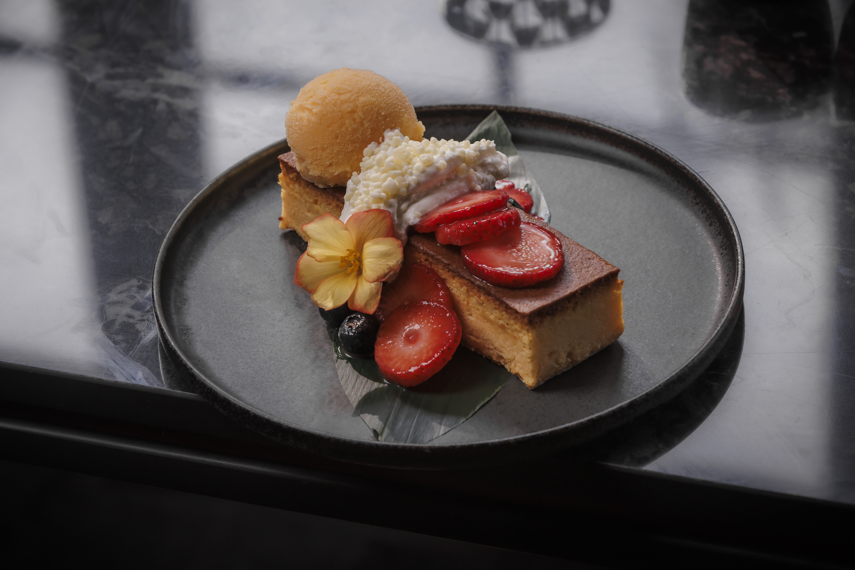 Mandarin Cloud Cake: Fluffy Japanese cheesecake, yuzu-ginger berries, white chocolate popping candy, orange sherbet