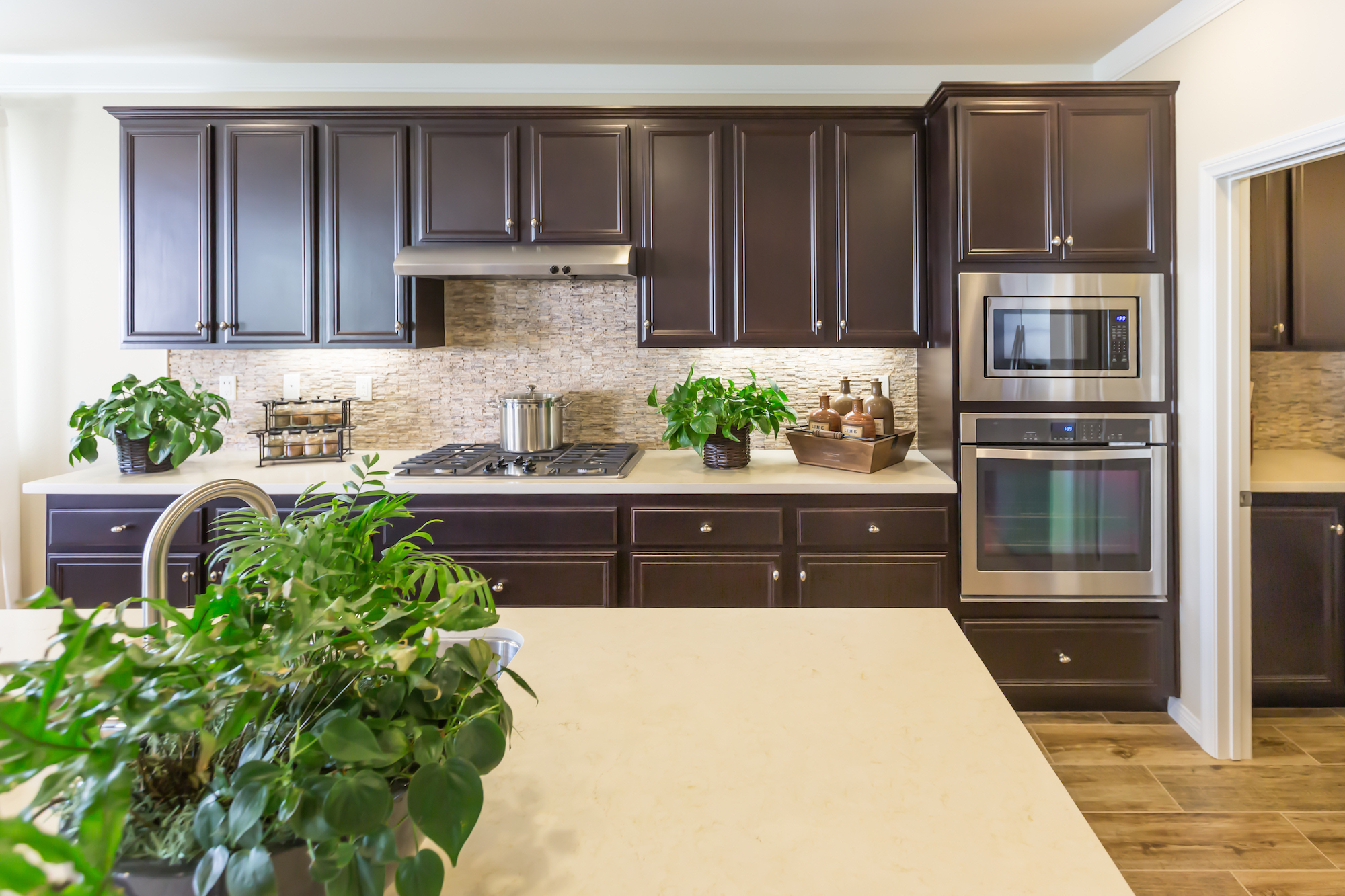 Large kitchen after cabinet painting in Cohasset