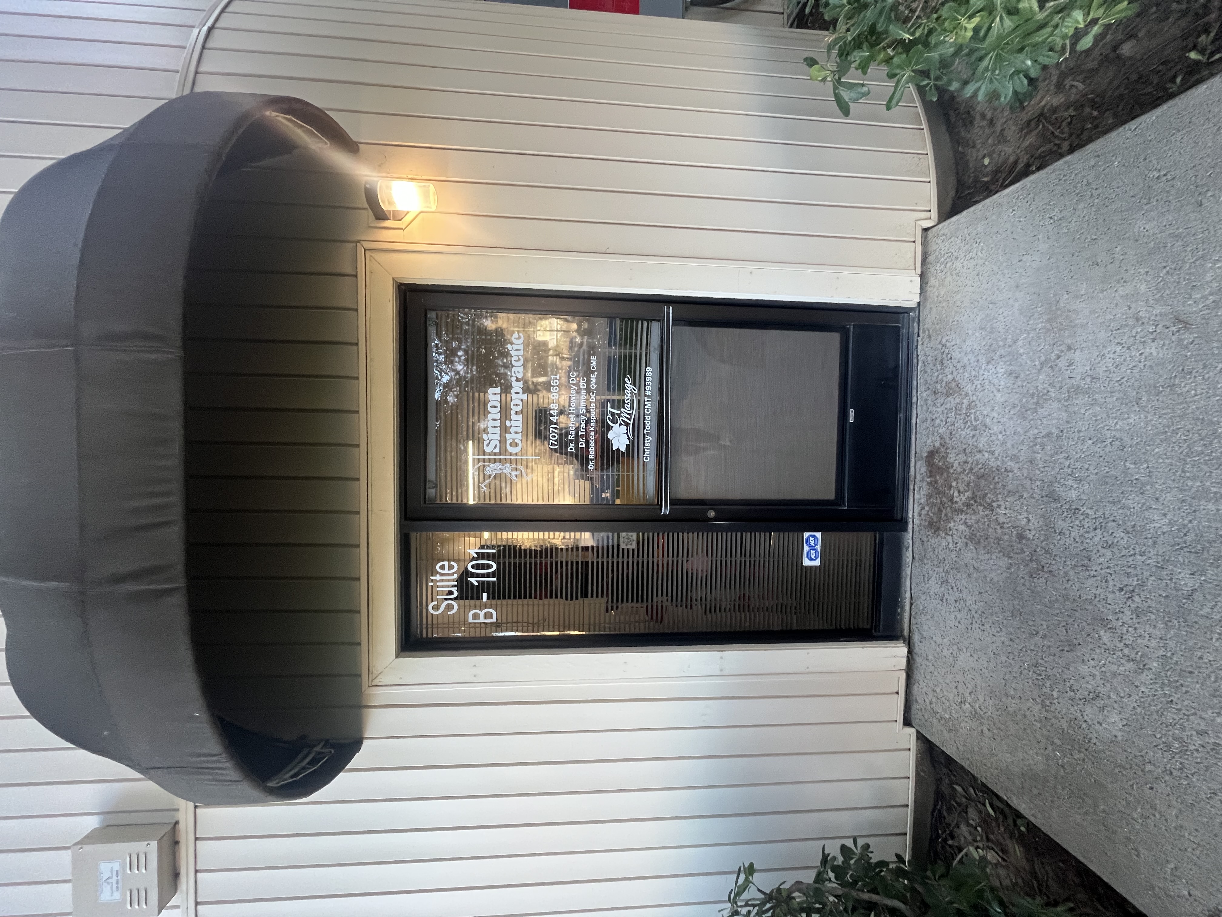 The exterior business signage of Simon Chiropractic.