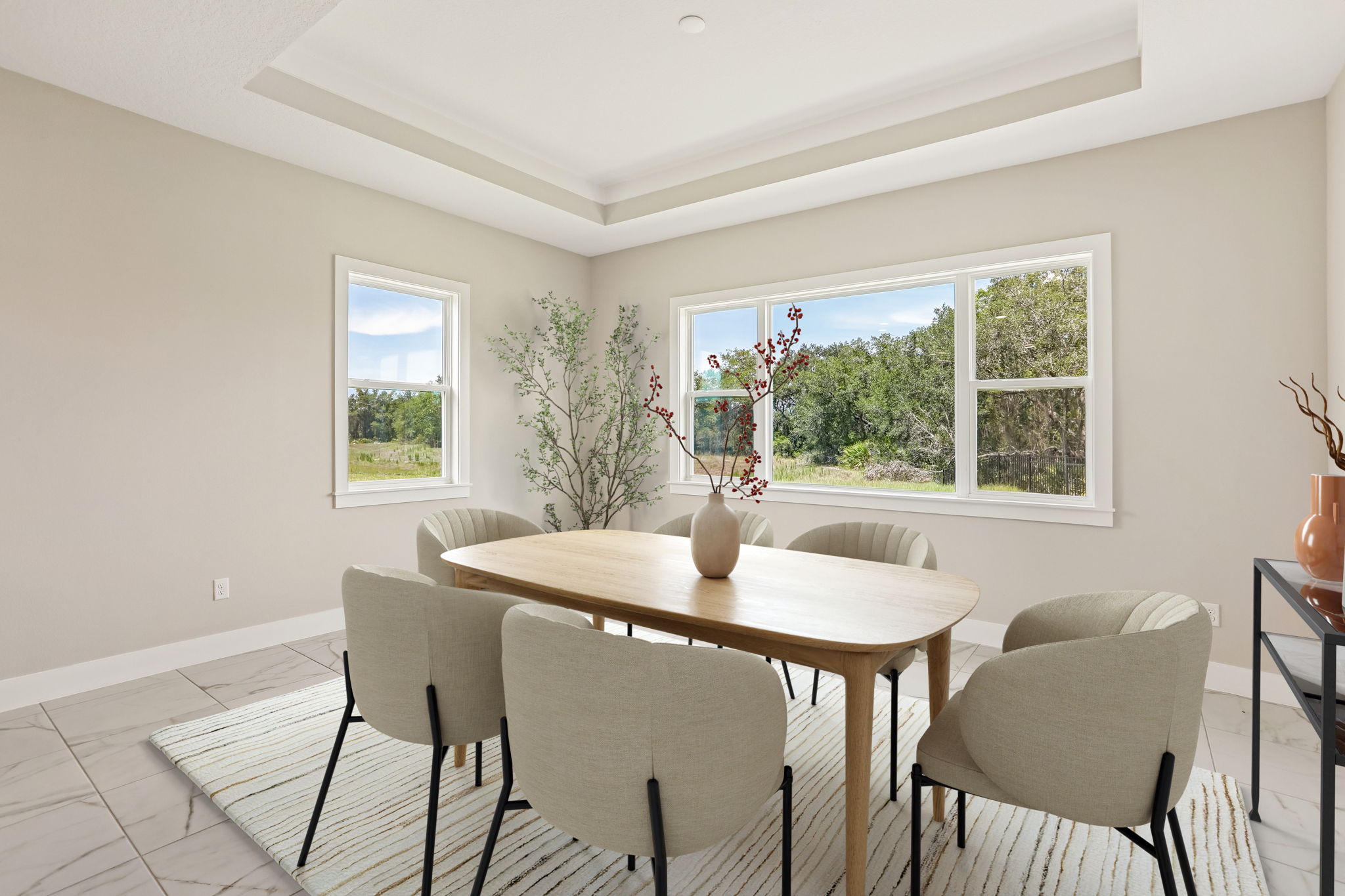 The Dining Room of a DRB Homes Sabal Home Plan at Serengeti in Spring Hill, FL. 