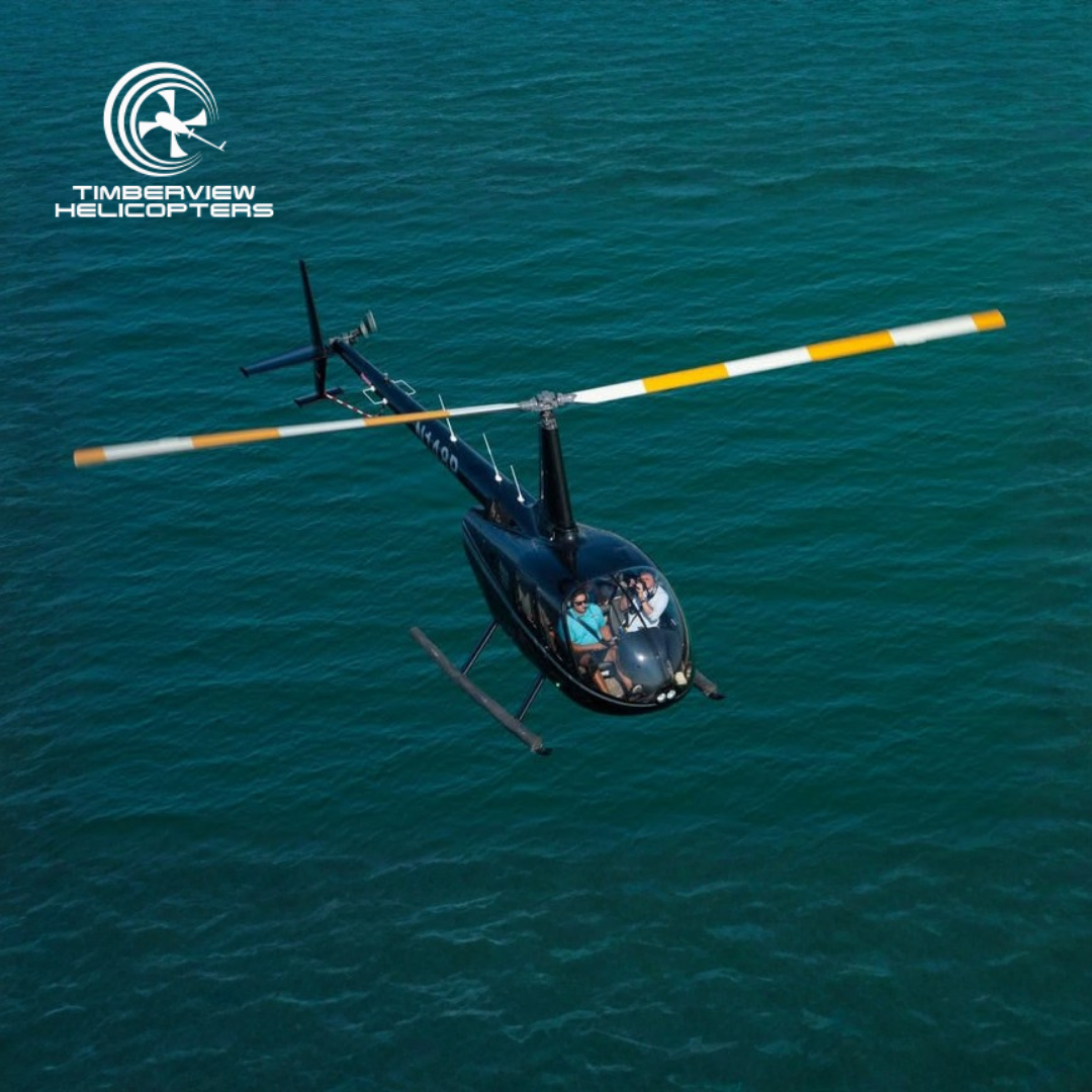 Experience the thrill of soaring in our blue helicopter as it glides over the crystal-clear waters of the Gulf of Mexico. This shot captures one of our popular beach tours, showing the incredible contrast between our aircraft and the vibrant emerald-green sea. We take pride in offering the best vantage point for spotting local marine life like sharks and rays from above. It’s a perfect example of why our Destin helicopter tours are a "must-do" for every Florida vacation.
