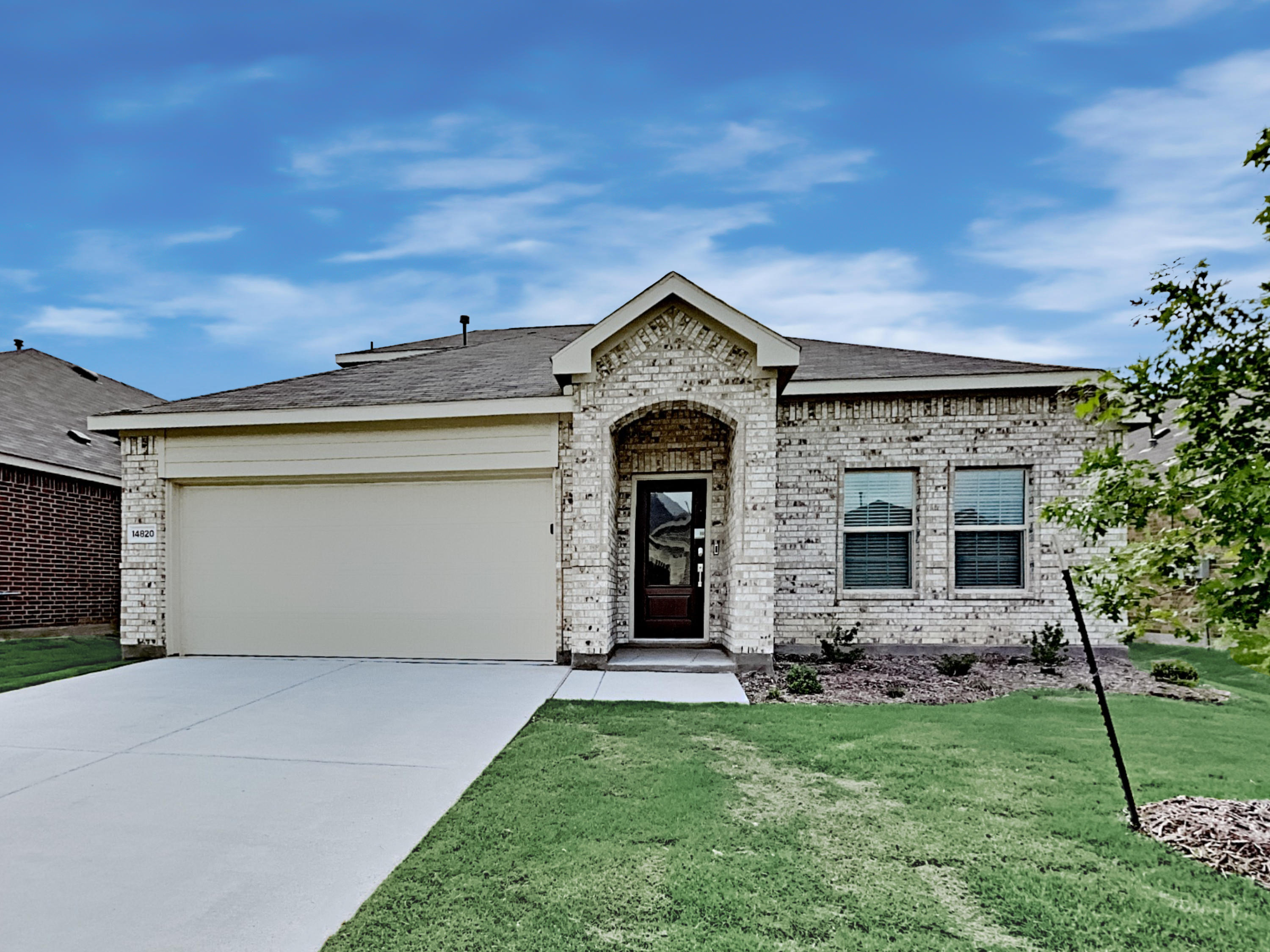 Lovely home with two-car garage and covered porch at Invitation Homes Dallas.