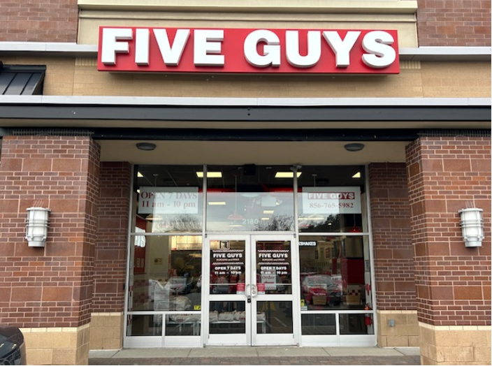 Exterior photograph of the Five Guys restaurant at 2180 N. 2nd Street in Millville, New Jersey.