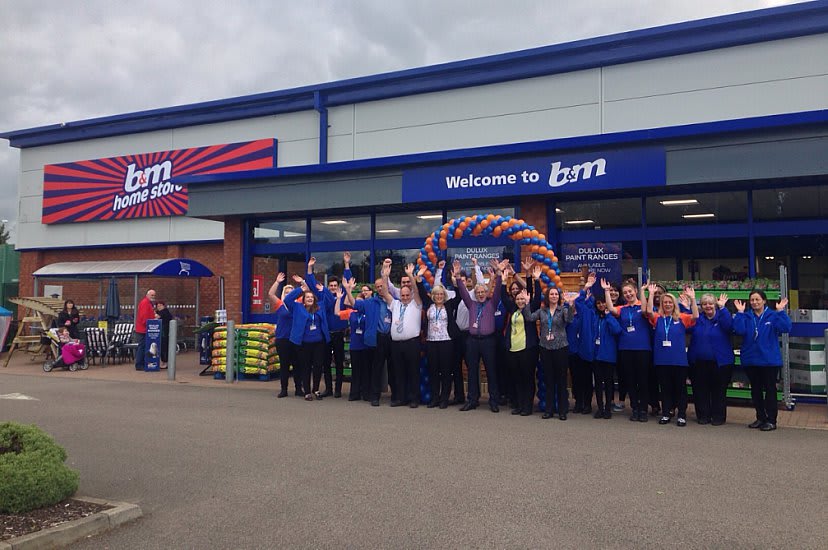 Staff celebrate the opening of the latest B&M store in Towcester