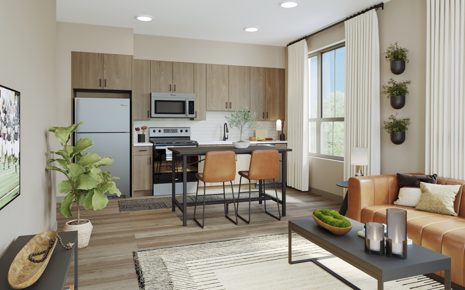Spacious open concept kitchen with stainless steel appliances and ample storage cabinets.