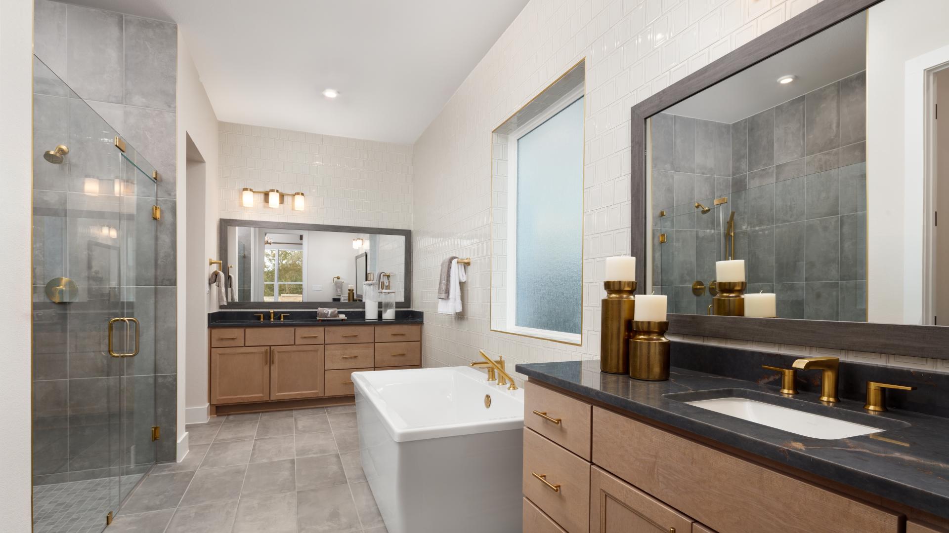 Luxurious primary baths with an oversized shower and soaking tub 