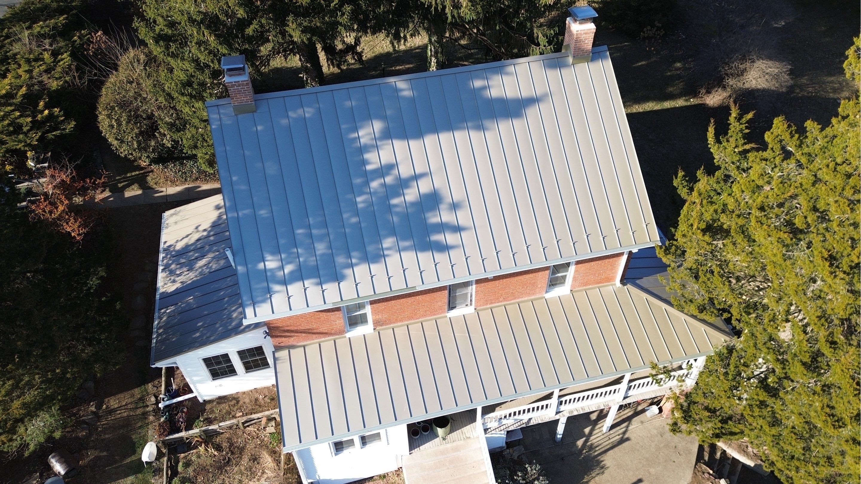Aerial view of a completed Englert standing seam metal roof replacement in Westminster, Maryland, sh 