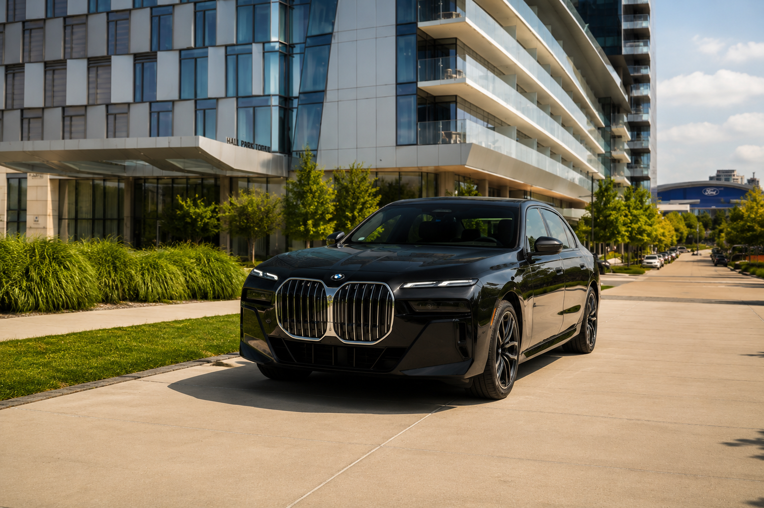Black BMW 7 Series luxury sedan parked outside a modern building, representing MP Limousine's first-class chauffeur and executive transportation service in Dallas.