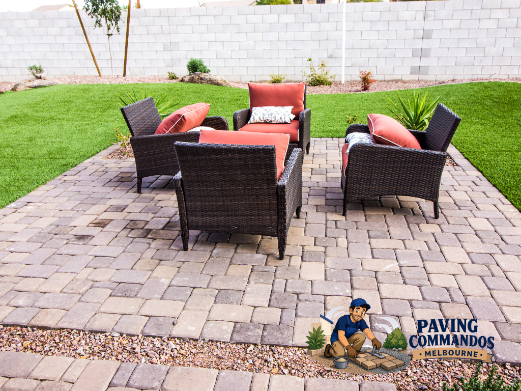Outdoor paver patio with seating furniture, creating a comfortable space for entertaining and enjoying the landscaped yard.