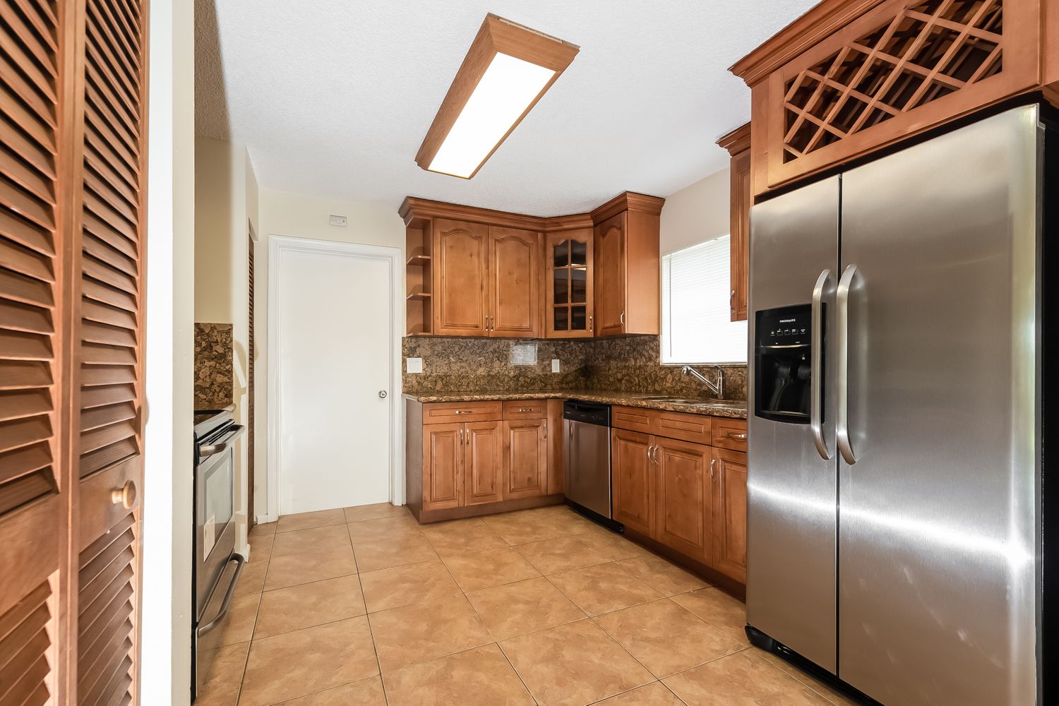 Beautiful kitchen with stainless steel appliances at Invitation Homes South Florida.