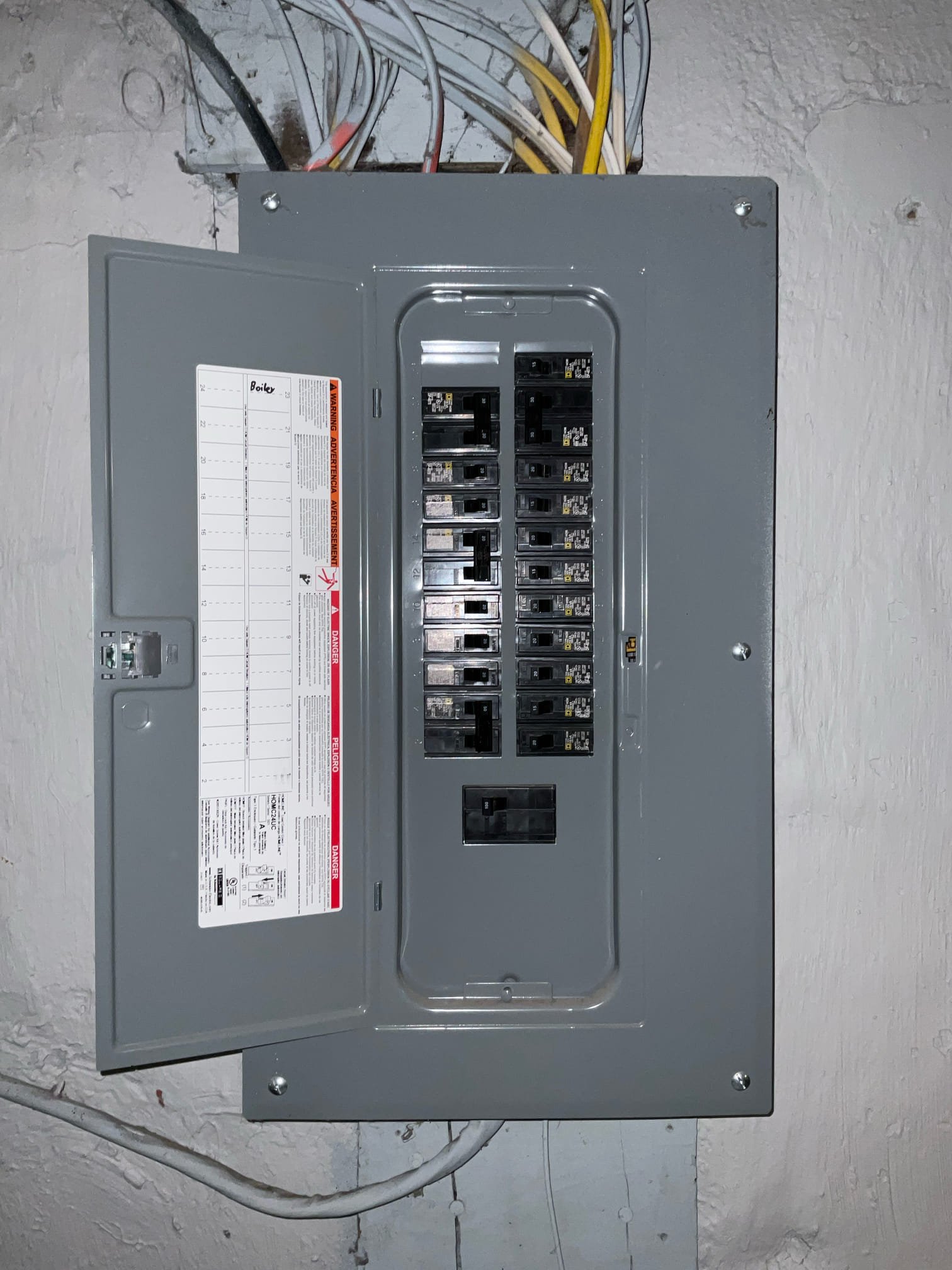 Thomas Edison Electric installed this Square D subpanel in a Drexel Hill, PA basement. The labeled circuit directory on the door shows a clean layout with room for future expansion, and the panel is wall-mounted directly to the foundation for a compact installation.