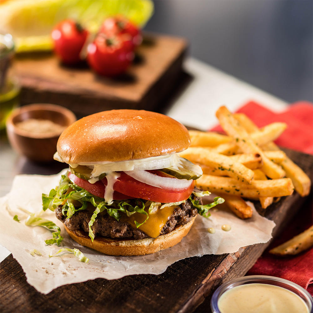 Classic Burger: Grilled medium-well. Lettuce, tomato, pickles and onions. Served with fries.