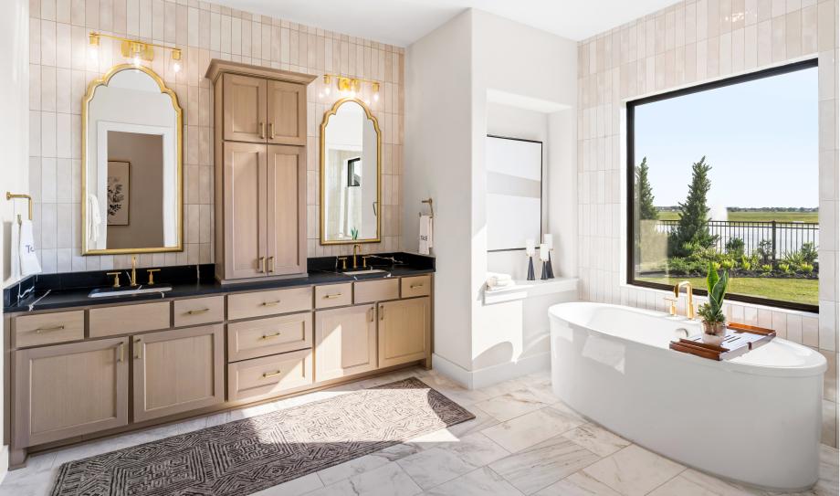 Spa-inspired bathroom with dual vanities and freestanding soaking tub