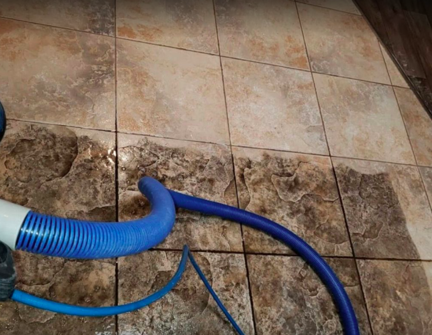 Technician performing tile cleaning in Orange County, CA