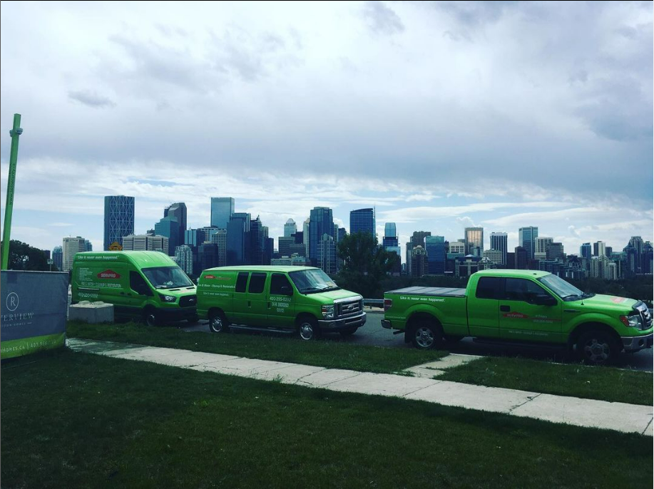A fleet of SERVPRO vehicle parked overlooking downtown Calgary SERVPRO of Calgary Downtown, Skyview, South-Southeast Calgary (403)255-0202