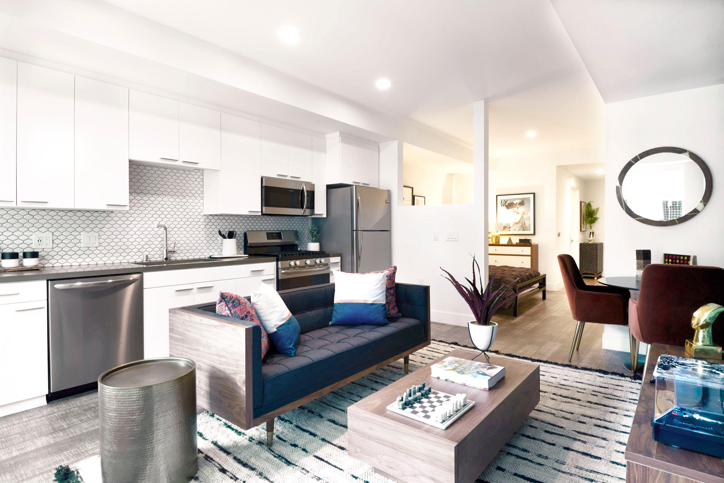 Kitchen and bedroom at Sentral DTLA at 732 S. Spring