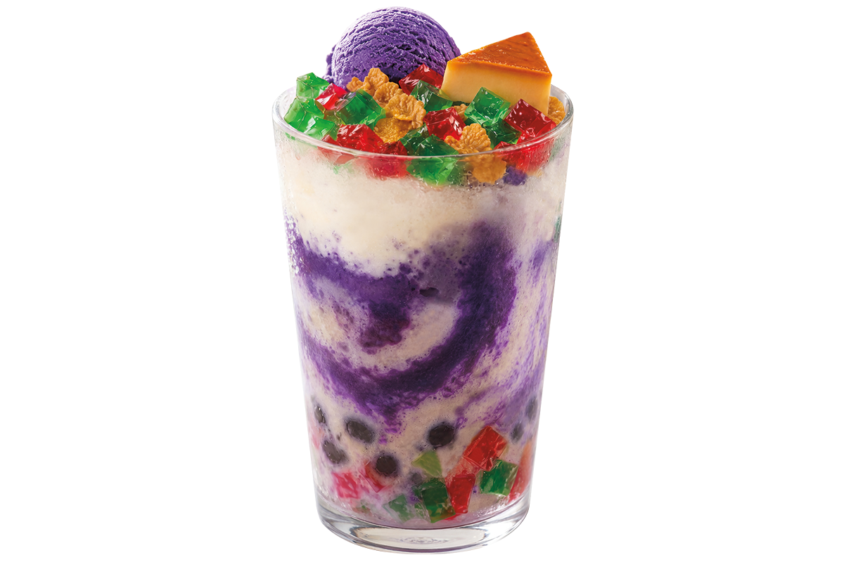 Chowking Halo-Halo dessert in a clear glass, topped with ube ice cream, leche flan, cornflakes, and vibrant jellies.