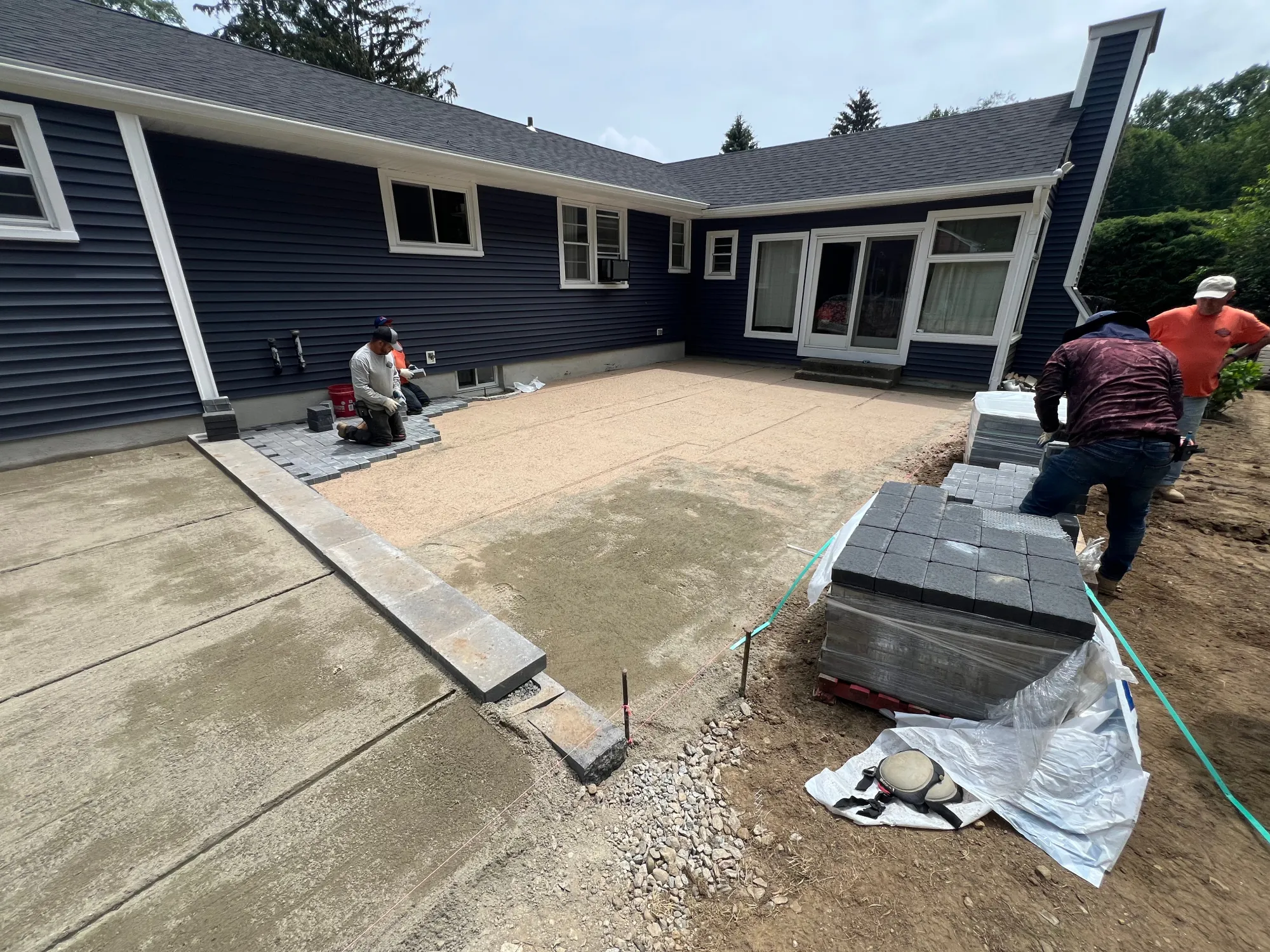 Base and grading work for a Trumbull paver patio - Multi-Layered Paver Patio, Trumbull project by General Masonry LLC.