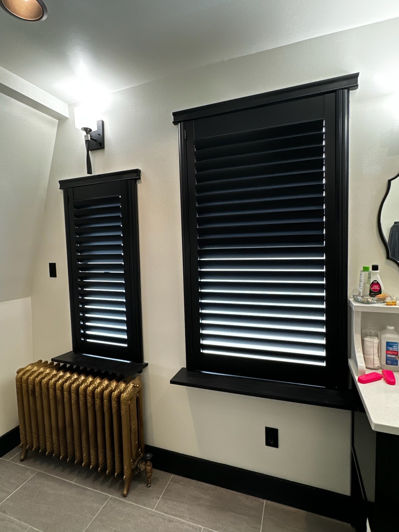 Interior shutters don't always need to be white.  These shutters are absolutely stunning in black!