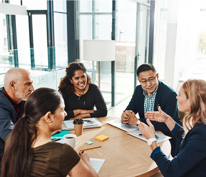 Team of advisors having a lively discussion during a meeting.