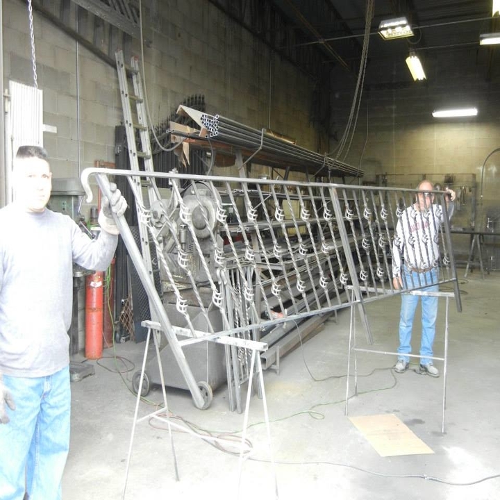 M C M Iron Works Logo