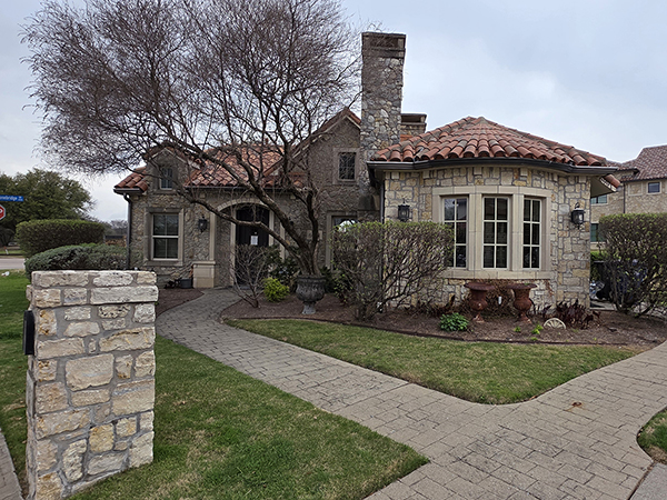 Exterior photo of angled entrance of the AudioNova hearing clinic in McKinney, TX