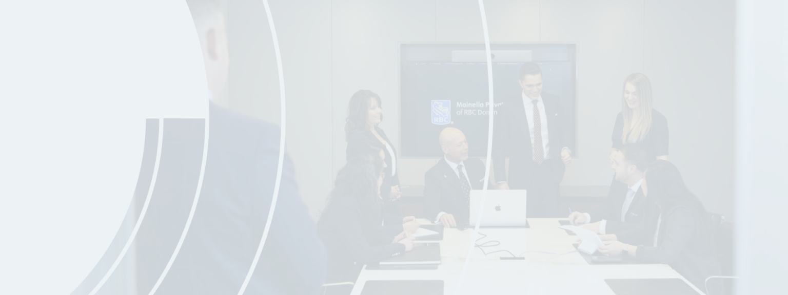 Alexander Mainella and team collaborating in a board room.