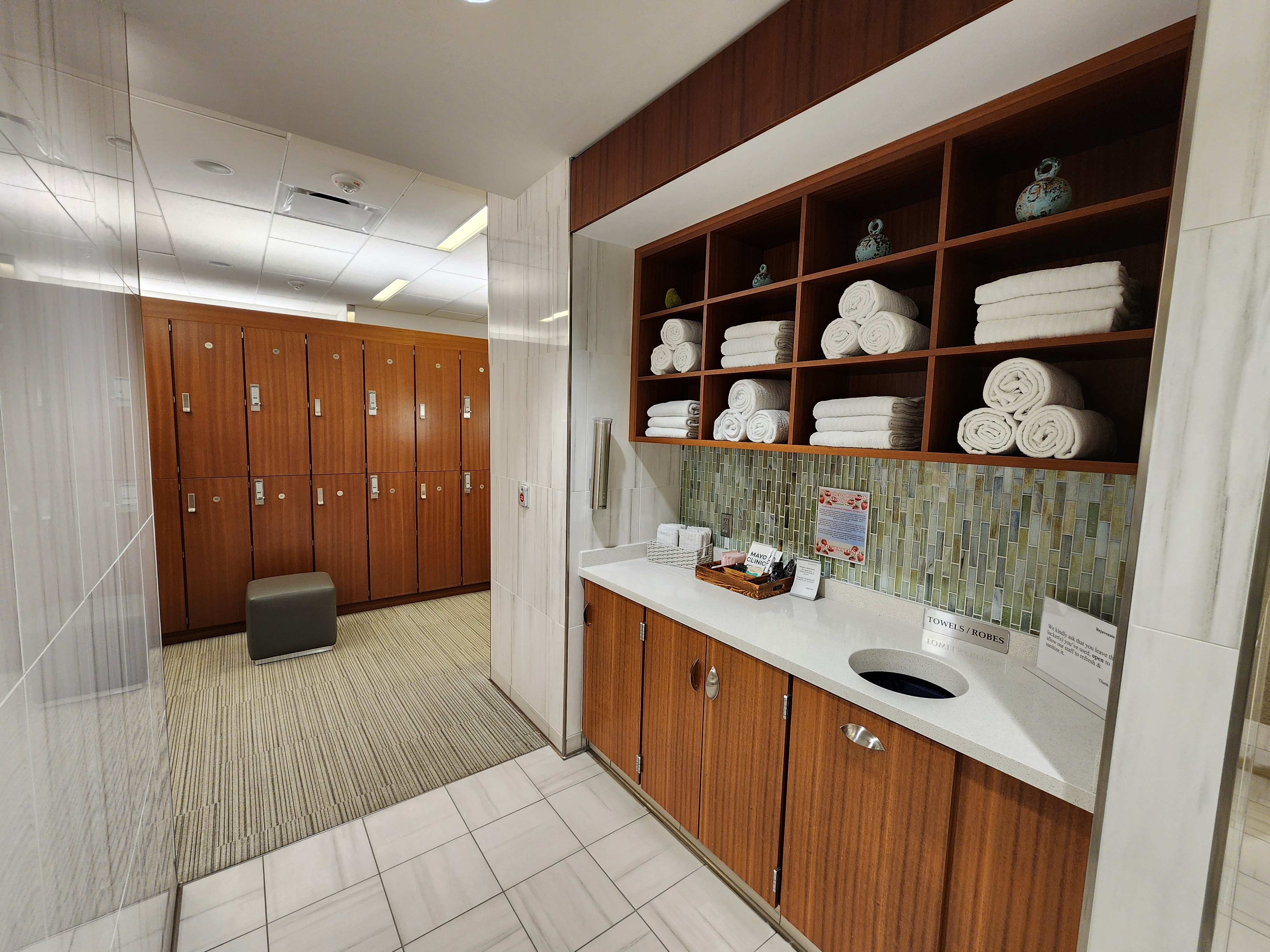 Locker room hallway with private changing areas and storage