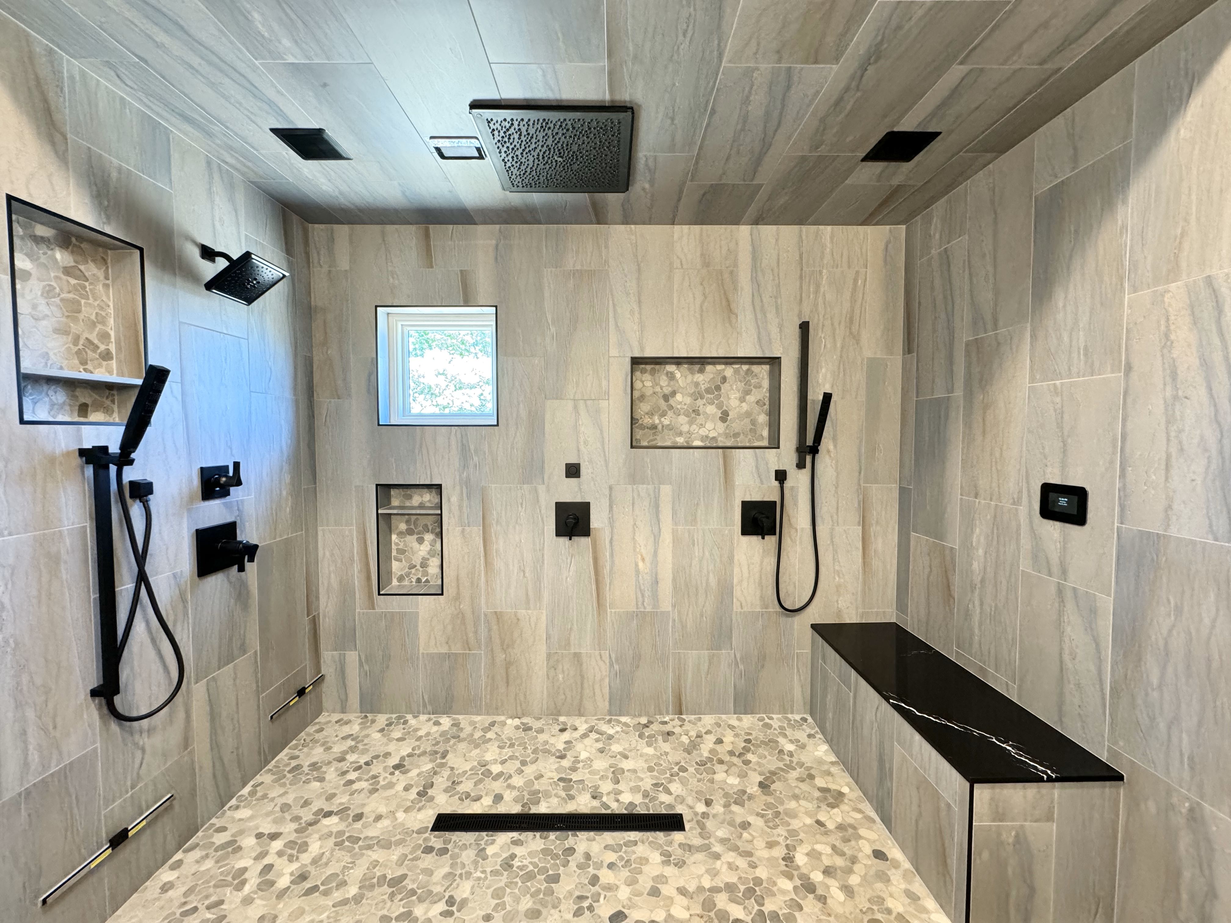 Here's one of our finished bathroom remodeling projects at Ledezma Remodeling—a stunning steam shower combining modern elegance and ultimate functionality. Visit our website to schedule your free estimate or learn more about our shower remodeling services.