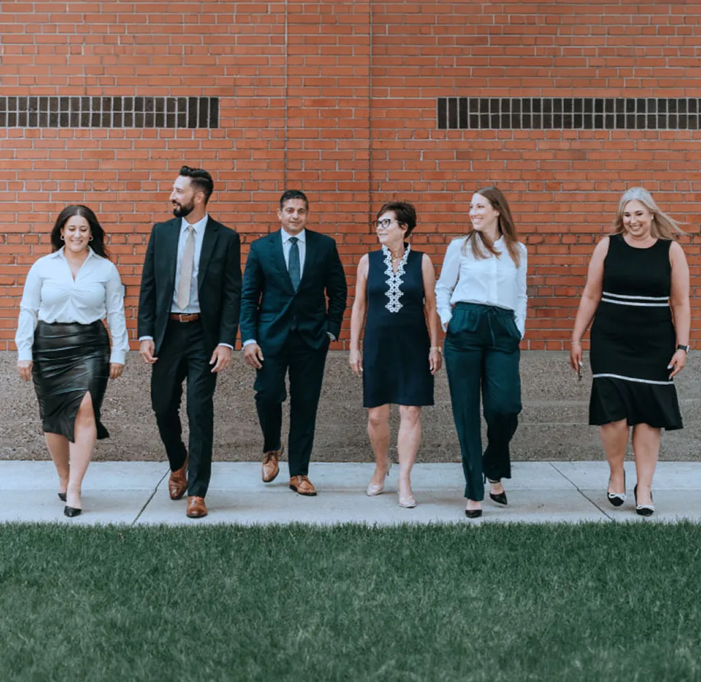 The Georges Landry Wealth Advisory team walking side by side.