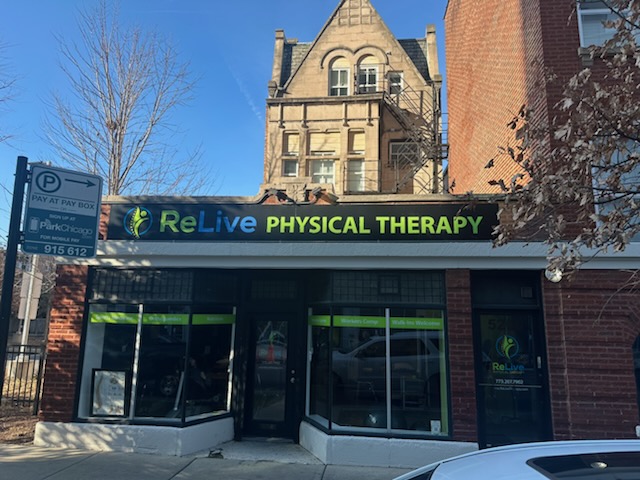 Relive Physical Therapy in Bloomingdale, IL features a welcoming street-front clinic with large windows and clear signage that makes it easy to spot. The exterior showcases the modern ReLive Physical Therapy logo and bold lettering, giving the clinic a professional and approachable look. Through the front windows, you can see an inviting therapy space equipped for rehabilitation, exercise, and patient care. The storefront displays helpful service indicators such as Workers Comp, Walk-Ins Welcome, and Nutrition, highlighting the clinic&rsquo;s commitment to accessible, comprehensive physical therapy services. Conveniently located at street level with easy sidewalk access, Relive Physical Therapy offers a friendly environment designed to support healing and wellness for patients of all ages.