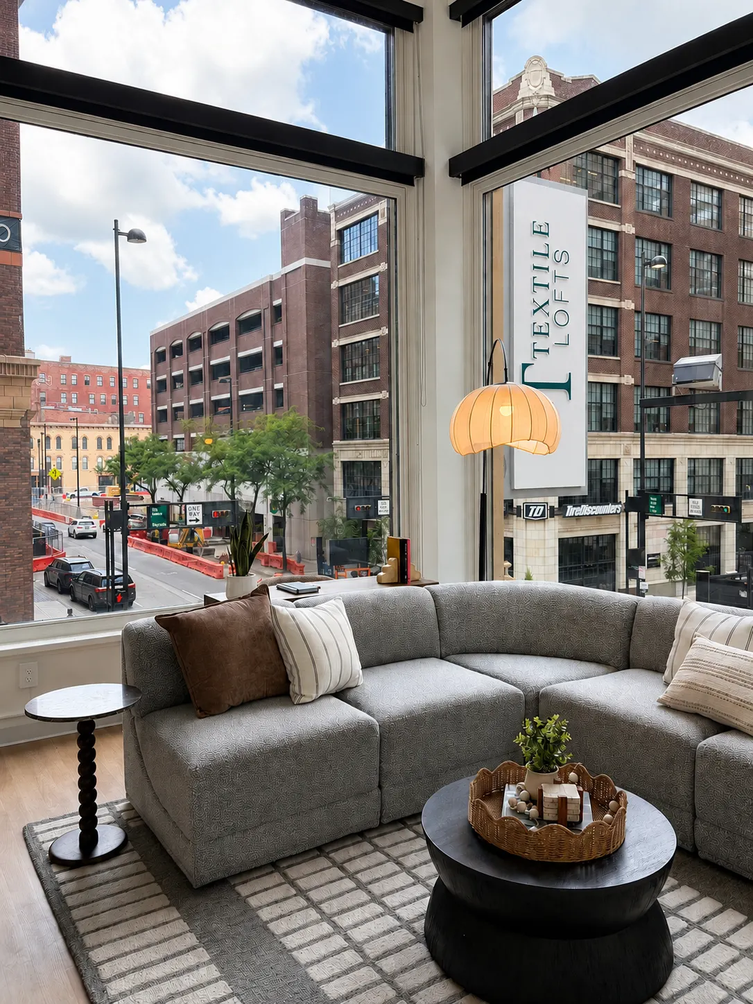 A grey couch with a small table in front of it