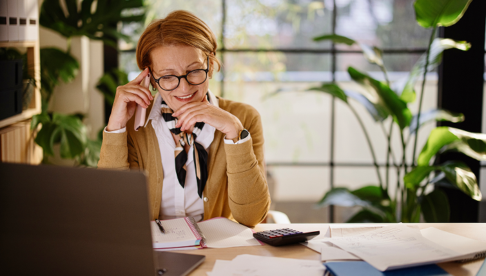 A professional looking over her taxes in her home office.