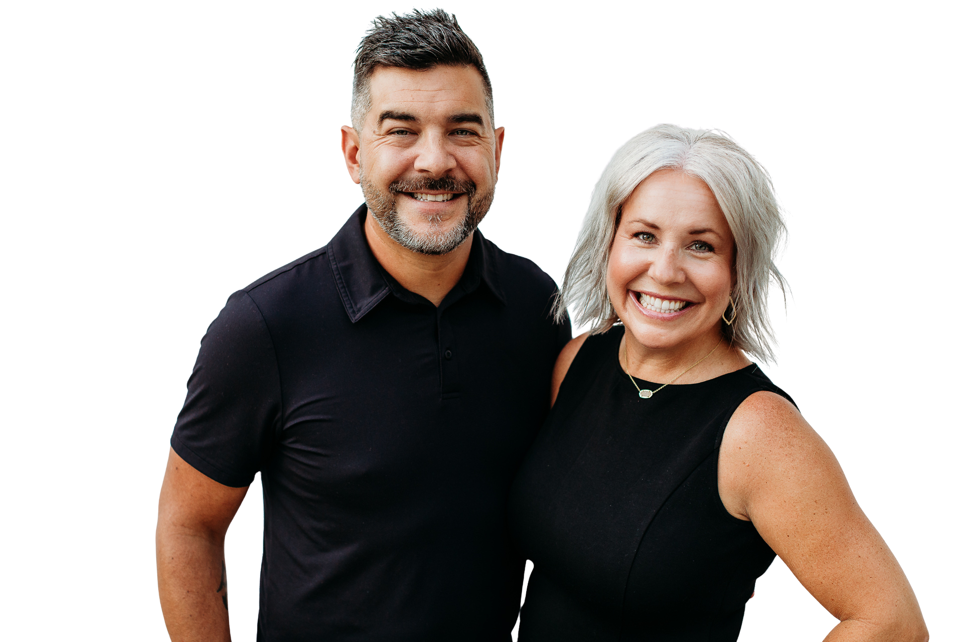 Two smiling owners of Agency Ten10 standing together in a professional portrait, dressed in black, against a transparent background.
