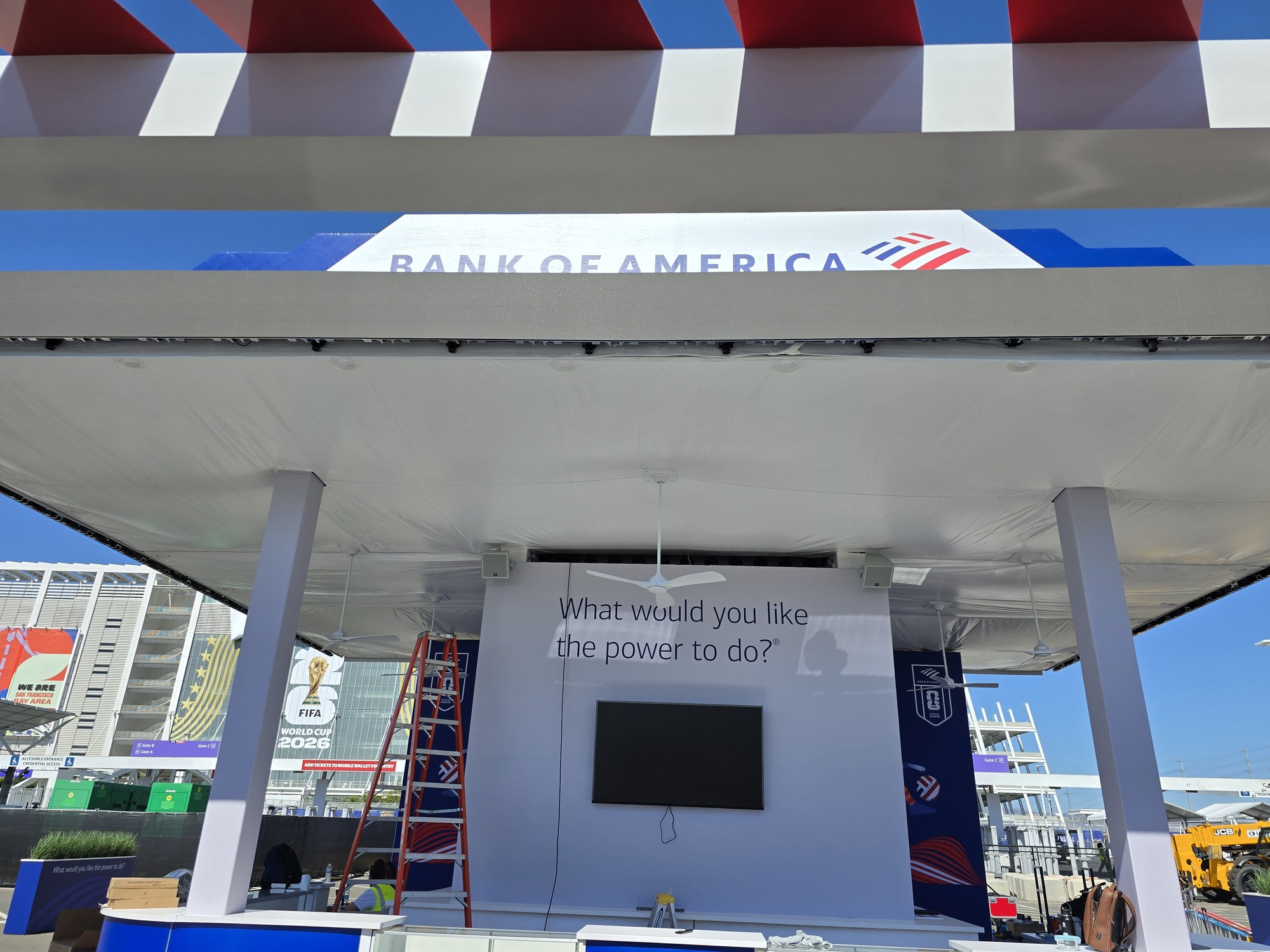 Custom Bank of America outdoor event pavilion featuring branded canopy signage, integrated screens, and a spacious reception area.