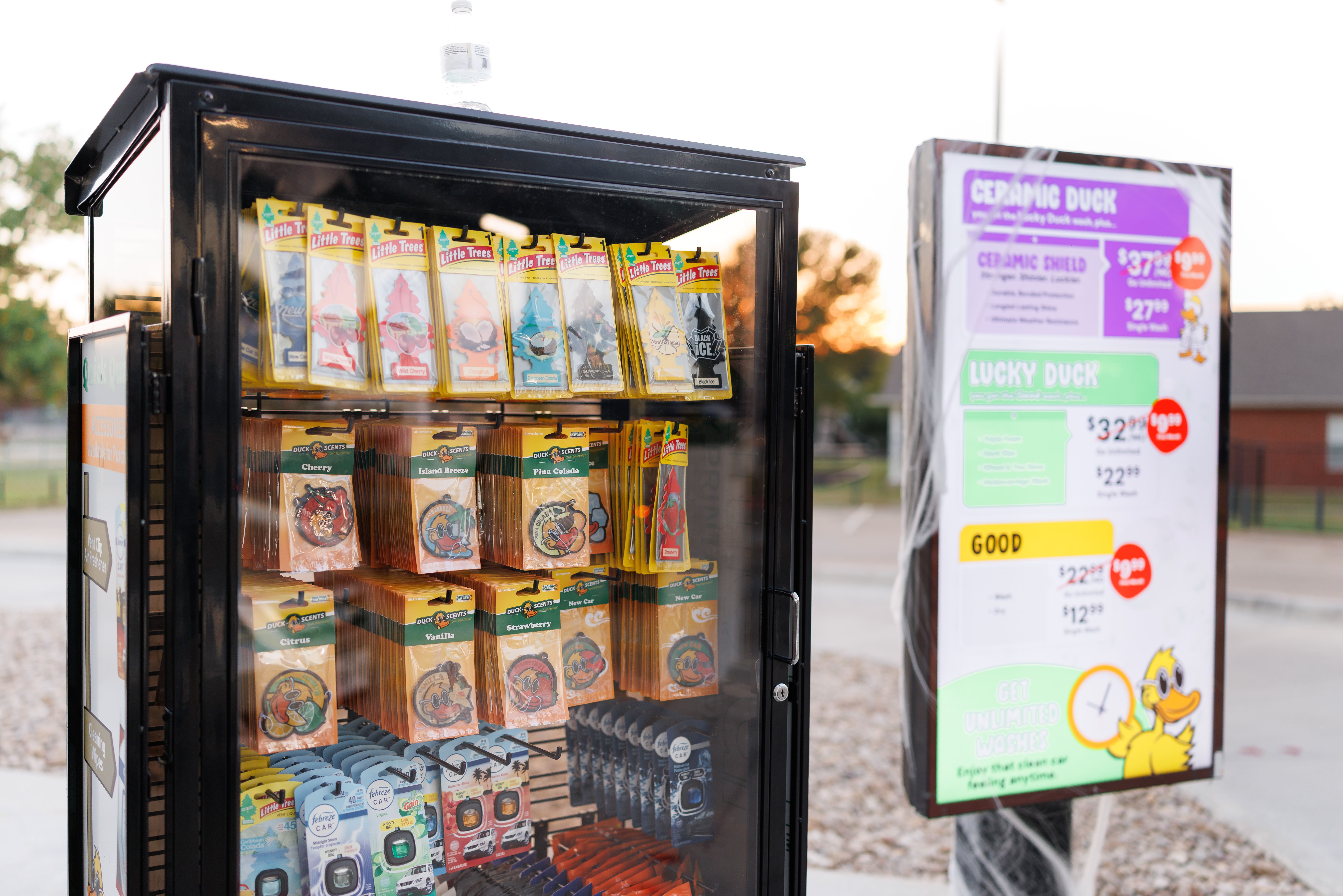 Quick Quack Car Wash offers convenient add-on products including Duck Scents and Little Trees air fresheners alongside affordable unlimited wash membership plans to keep your car clean and smelling fresh.