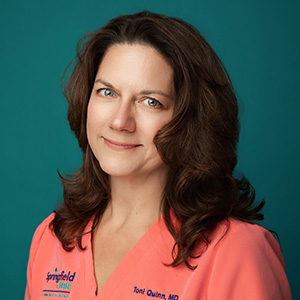 Female doctor smiling in professional headshot.