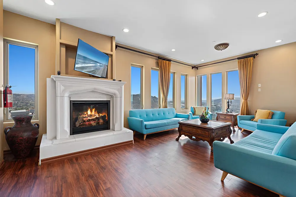 Spacious and naturally lit relaxation room designed to provide comfort, tranquility, and a calming space between therapy sessions.