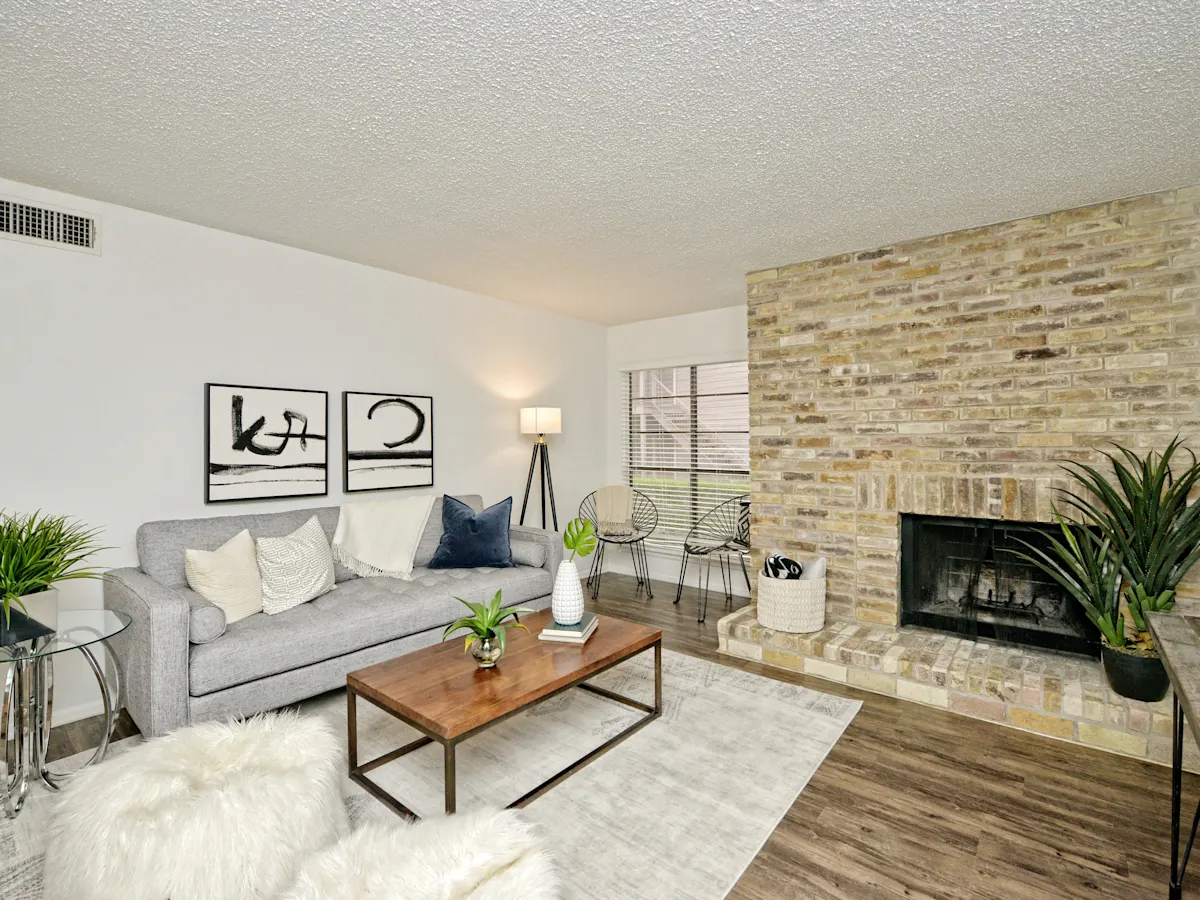 a living room with a couch and a fireplace