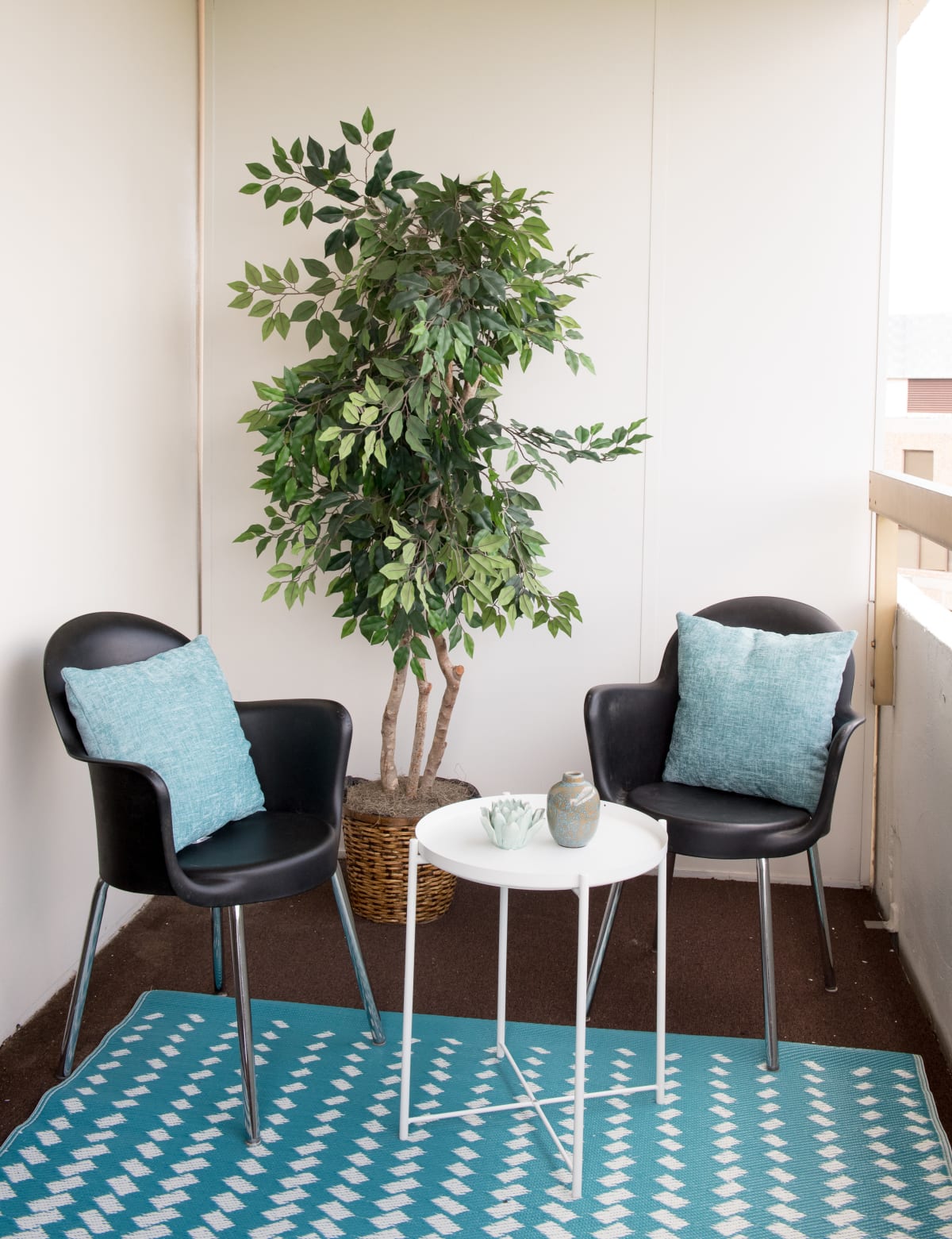 Balcony setup with table and chairs