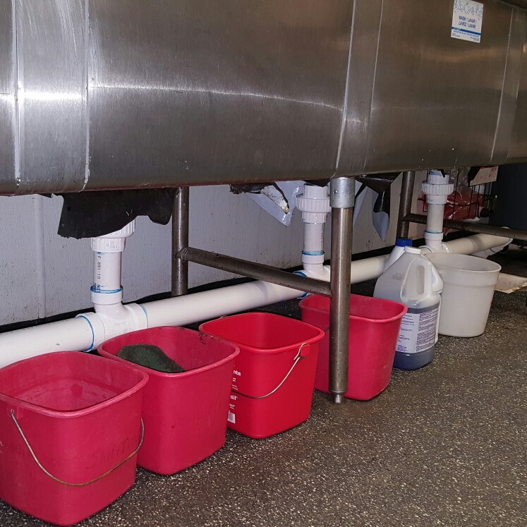 restaurant 4 bowl sink drain, reconfigured to allow easier repair in future.