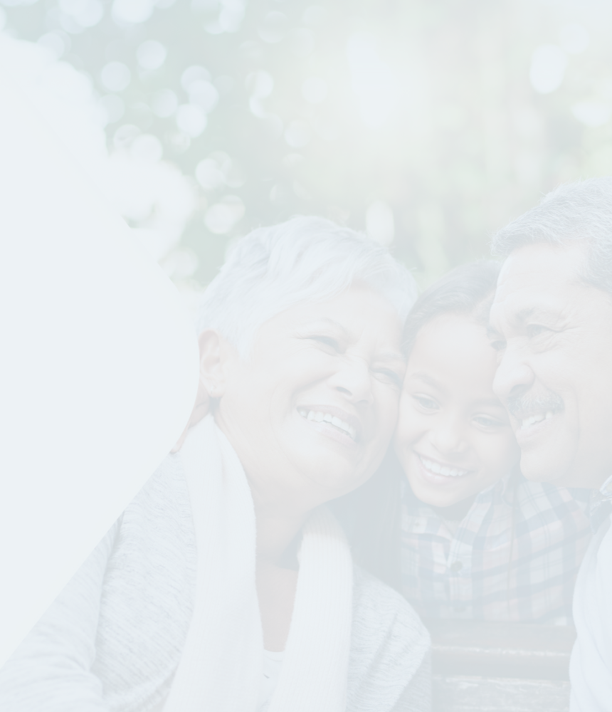 An intergenerational family sharing a hug.