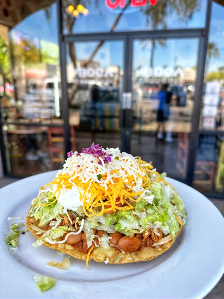 Crisp flour shell loaded with beans, meat, cheese, lettuce, cheese, pico, guac and sour cream. 