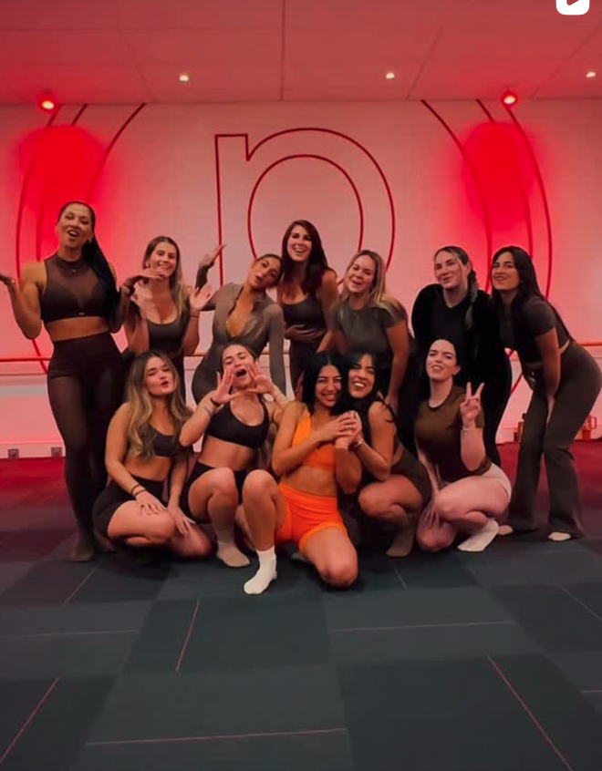 Pure Barre Aventura community — group fitness class members celebrating a birthday together at our Aventura, FL barre studio